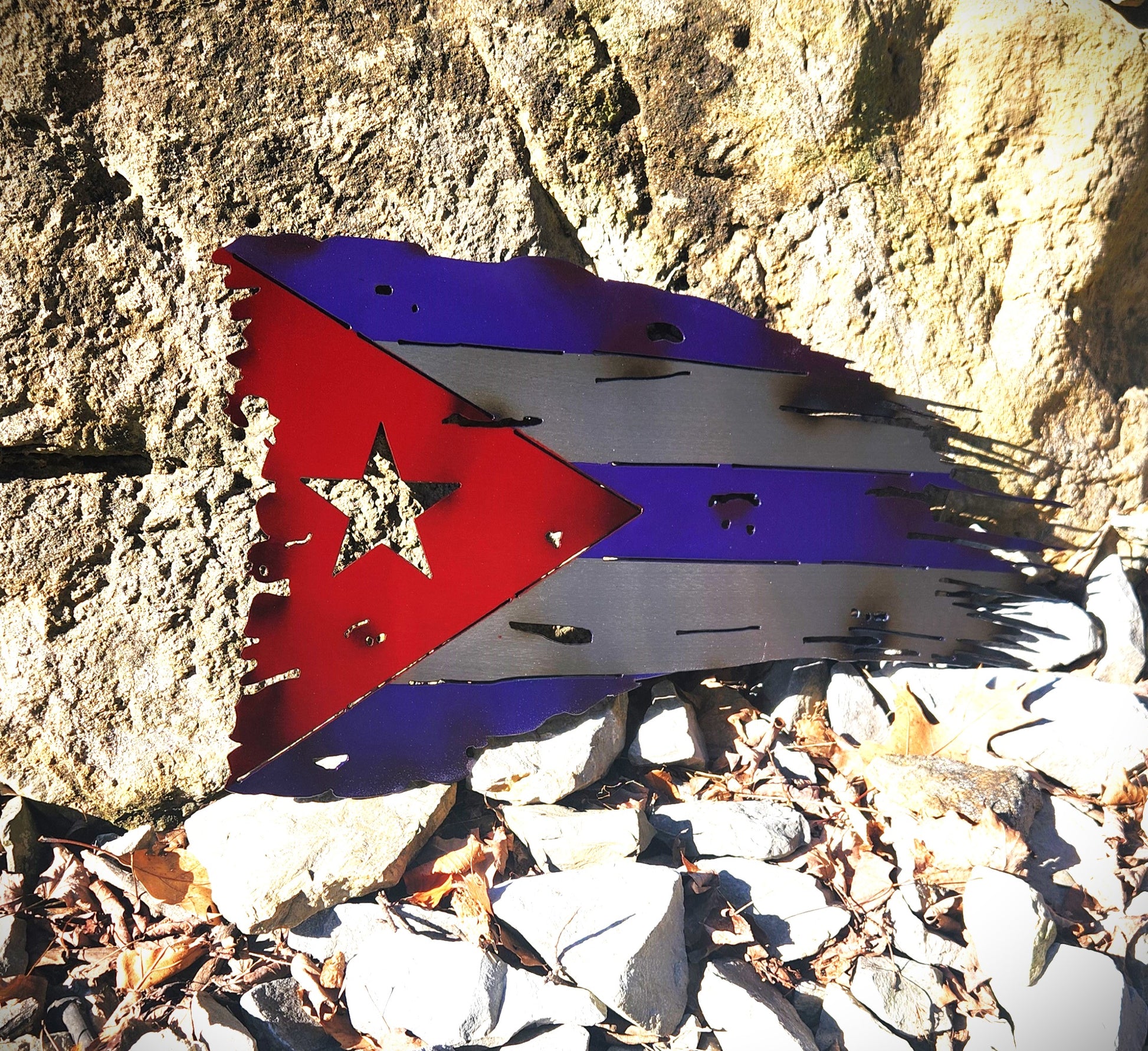 Tattered battle worn distressed Cuban Metal Flag